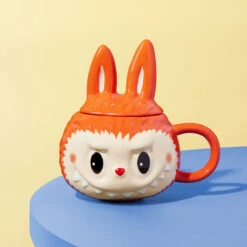 LABUBU Originals - Orange Profiled Mug -Outlet Mega Plush Store scene 02 hNjNOHn99G 1200x1200